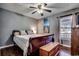 Bedroom with a wooden sleigh bed and ceiling fan at 1500 Docksider Ct., Surfside Beach, SC 29575