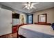 Bedroom with wooden sleigh bed and en-suite bathroom at 1500 Docksider Ct., Surfside Beach, SC 29575