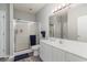 A clean bathroom featuring a shower, toilet, vanity, and a large mirror that is well-lit at 1525 Lanterns Rest Rd. # 102, Myrtle Beach, SC 29579