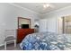 This well-lit bedroom includes a ceiling fan, and neutral walls that complement the wood-look flooring at 1525 Lanterns Rest Rd. # 102, Myrtle Beach, SC 29579