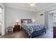 A calming main bedroom features a ceiling fan, closet, and a glass sliding door to the outside at 1525 Lanterns Rest Rd. # 102, Myrtle Beach, SC 29579