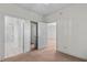 Bedroom with neutral walls, tan carpet, and ensuite bathroom and closet access at 1538 Lanterns Rest Rd. # 103, Myrtle Beach, SC 29579