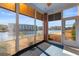 Enclosed sunroom with brick accents and large windows overlooking the water at 1538 Lanterns Rest Rd. # 103, Myrtle Beach, SC 29579