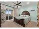 Primary bedroom with a king-size bed and private balcony access at 1601 Waterway Dr., North Myrtle Beach, SC 29582