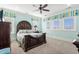 Bedroom with a dark wood bed frame and light teal walls at 1601 Waterway Dr., North Myrtle Beach, SC 29582