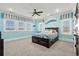 Light blue bedroom featuring a wooden bed and ocean decor at 1601 Waterway Dr., North Myrtle Beach, SC 29582