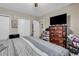 Cozy bedroom features neutral walls, tv, ample closet space, and a ceiling fan at 1817 South Island Rd., Georgetown, SC 29440