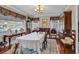 Charming dining room featuring a chandelier, a white-clothed table, and ample natural light from the windows at 1817 South Island Rd., Georgetown, SC 29440