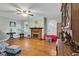 Spacious living room with hardwood floors, fireplace, ceiling fan, and ample natural light at 1817 South Island Rd., Georgetown, SC 29440