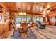 Relaxing living room with a wood paneled ceiling and walls and a beautiful rug at 1817 South Island Rd., Georgetown, SC 29440