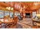 Inviting living room with wood-paneled walls and ceiling, and lots of natural light at 1817 South Island Rd., Georgetown, SC 29440