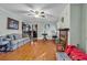 Inviting living room featuring a fireplace, hardwood floors, and a comfortable seating area at 1817 South Island Rd., Georgetown, SC 29440