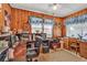 Cozy office space with wood paneling and natural light from two windows, perfect for a home workspace at 1817 South Island Rd., Georgetown, SC 29440