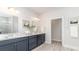 Elegant bathroom with double vanity and dark blue cabinets at 1844 Hardwood Ct., Conway, SC 29526