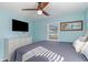 Bedroom with king-size bed, dresser, and large TV at 719 N Waccamaw Dr., Murrells Inlet, SC 29576