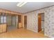 Small bathroom with floral wallpaper and linoleum flooring at 1901 Harris Short Cut Rd., Conway, SC 29526