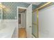 Bathroom with shower and gold framed glass enclosure at 1901 Harris Short Cut Rd., Conway, SC 29526