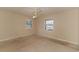 Bedroom with damaged flooring and large windows at 1901 Harris Short Cut Rd., Conway, SC 29526