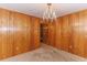 Dining room features wood paneling and a chandelier at 1901 Harris Short Cut Rd., Conway, SC 29526