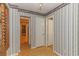 Hallway with patterned wallpaper and doors to other rooms at 1901 Harris Short Cut Rd., Conway, SC 29526