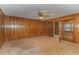 Spacious living room with wood paneled walls and ceiling fan at 1901 Harris Short Cut Rd., Conway, SC 29526