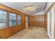 Sunroom with wood paneling, multiple windows, and French doors at 1901 Harris Short Cut Rd., Conway, SC 29526