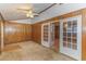 Sunroom with wood paneling, French doors, and access to exterior at 1901 Harris Short Cut Rd., Conway, SC 29526