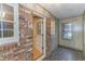 Sunroom features brick wall and stone tile flooring at 1901 Harris Short Cut Rd., Conway, SC 29526