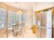 Bright dining area featuring table, chairs, stainless steel refrigerator, and natural lighting at 2110 Green Heron Dr., Murrells Inlet, SC 29576