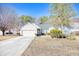 Charming single-story home with white siding, well-kept landscaping, and an attached two-car garage at 2110 Green Heron Dr., Murrells Inlet, SC 29576