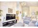 Cozy living room with neutral walls, plush carpet, and comfortable seating creating a welcoming atmosphere at 2110 Green Heron Dr., Murrells Inlet, SC 29576