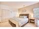 Comfortable main bedroom featuring a large bed, soft lighting, and closet creating a relaxing atmosphere at 2110 Green Heron Dr., Murrells Inlet, SC 29576