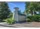 Welcoming entrance to The Park at The Bays featuring attractive brick signage, landscaping, and a serene atmosphere at 212 Minnow Ln., Murrells Inlet, SC 29576