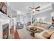 Spacious open-concept living room with fireplace and views into the formal dining room at 212 Minnow Ln., Murrells Inlet, SC 29576