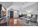 Spacious living room with hardwood floors, a ceiling fan, and a large window with shutters at 212 Minnow Ln., Murrells Inlet, SC 29576