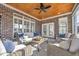 Relaxing screened porch featuring comfortable seating, a wooden ceiling, and a ceiling fan at 212 Minnow Ln., Murrells Inlet, SC 29576