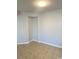 Empty bedroom with neutral walls, tile flooring, and ample natural light at 2265 Huntington Dr. # A, Surfside Beach, SC 29575