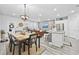 Elegant dining area with a rustic wood table and chandelier at 2475 Blue Crane Circle # 104, Myrtle Beach, SC 29577