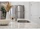 Modern kitchen island with granite countertop and stainless steel faucet at 2475 Blue Crane Circle # 104, Myrtle Beach, SC 29577