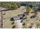 Overhead shot of brick home, detached garage and large surrounding property with mature trees at 2531 Smiley Ln., Conway, SC 29526