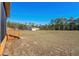 Large backyard with a storage building and an expansive grassy area, offering plenty of space at 2531 Smiley Ln., Conway, SC 29526