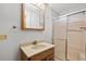 Clean bathroom with a vanity, medicine cabinet, and shower featuring glass doors at 2531 Smiley Ln., Conway, SC 29526