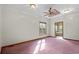 Bedroom with a ceiling fan, a window with sunlight, and an open doorway to the bathroom at 2531 Smiley Ln., Conway, SC 29526