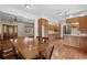 Bright dining area with wood floors, featuring an open view to the kitchen and living room at 2531 Smiley Ln., Conway, SC 29526