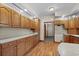 Traditional kitchen featuring wooden cabinets, laminate countertops and flooring, and recessed lighting at 2531 Smiley Ln., Conway, SC 29526