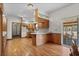 Eat-in kitchen featuring wood cabinetry, a breakfast bar, and access to the screened in porch at 2531 Smiley Ln., Conway, SC 29526