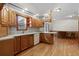 Spacious kitchen featuring light countertops, wooden cabinets, white dishwasher, and a view to the dining room at 2531 Smiley Ln., Conway, SC 29526