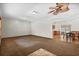 Open-concept living area with plush carpet leading into a dining area and kitchen at 2531 Smiley Ln., Conway, SC 29526