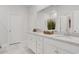 Bathroom showcasing a double vanity with granite countertops, white cabinets, and modern fixtures at 2539 Blue Crane Circle # 101, Myrtle Beach, SC 29577