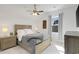 This bedroom features a ceiling fan, neutral walls, and bright natural light from the window at 2539 Blue Crane Circle # 101, Myrtle Beach, SC 29577